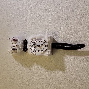 Jeweled White Kit-Cat Klock clock with black bow tie and tail